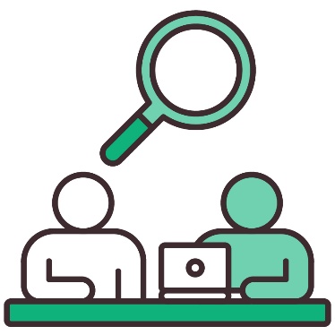 A magnifying glass above 2 people at a desk with a laptop.